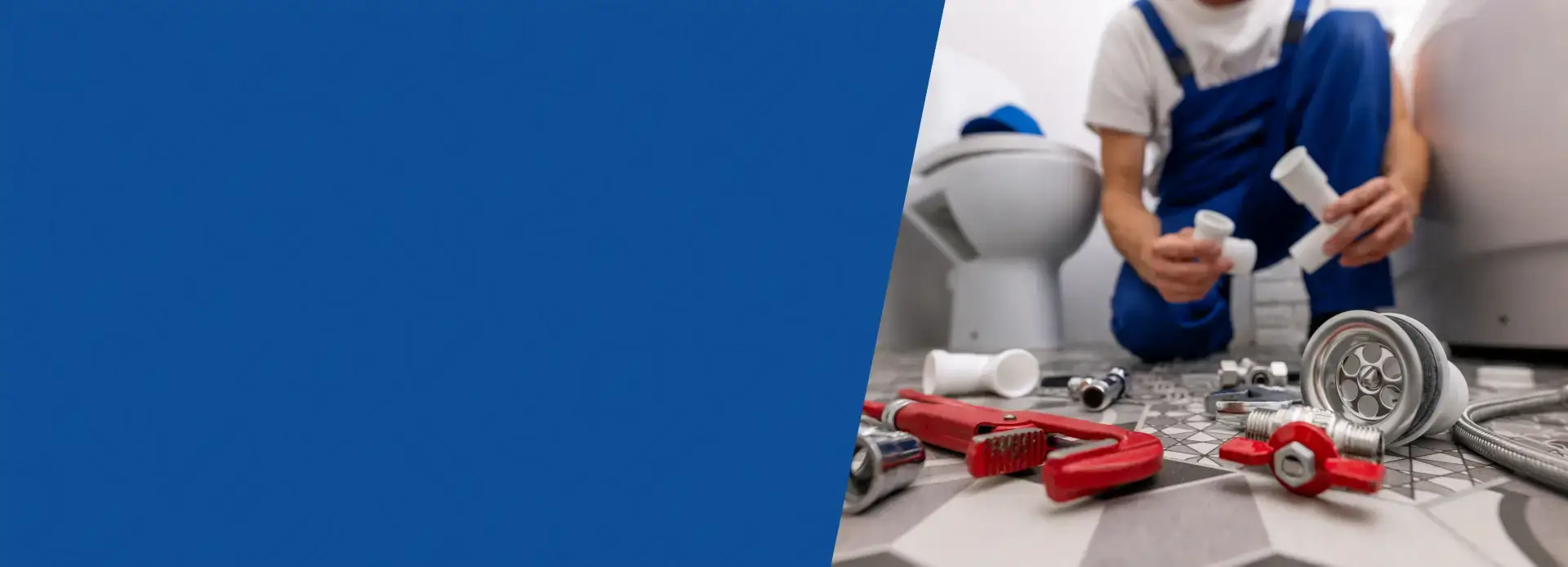 Plumber working with tools in bathroom