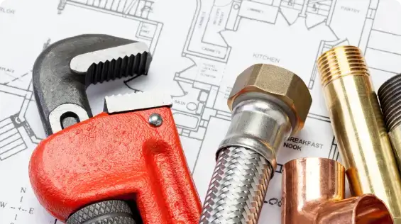 Pipe wrench and fittings on plans