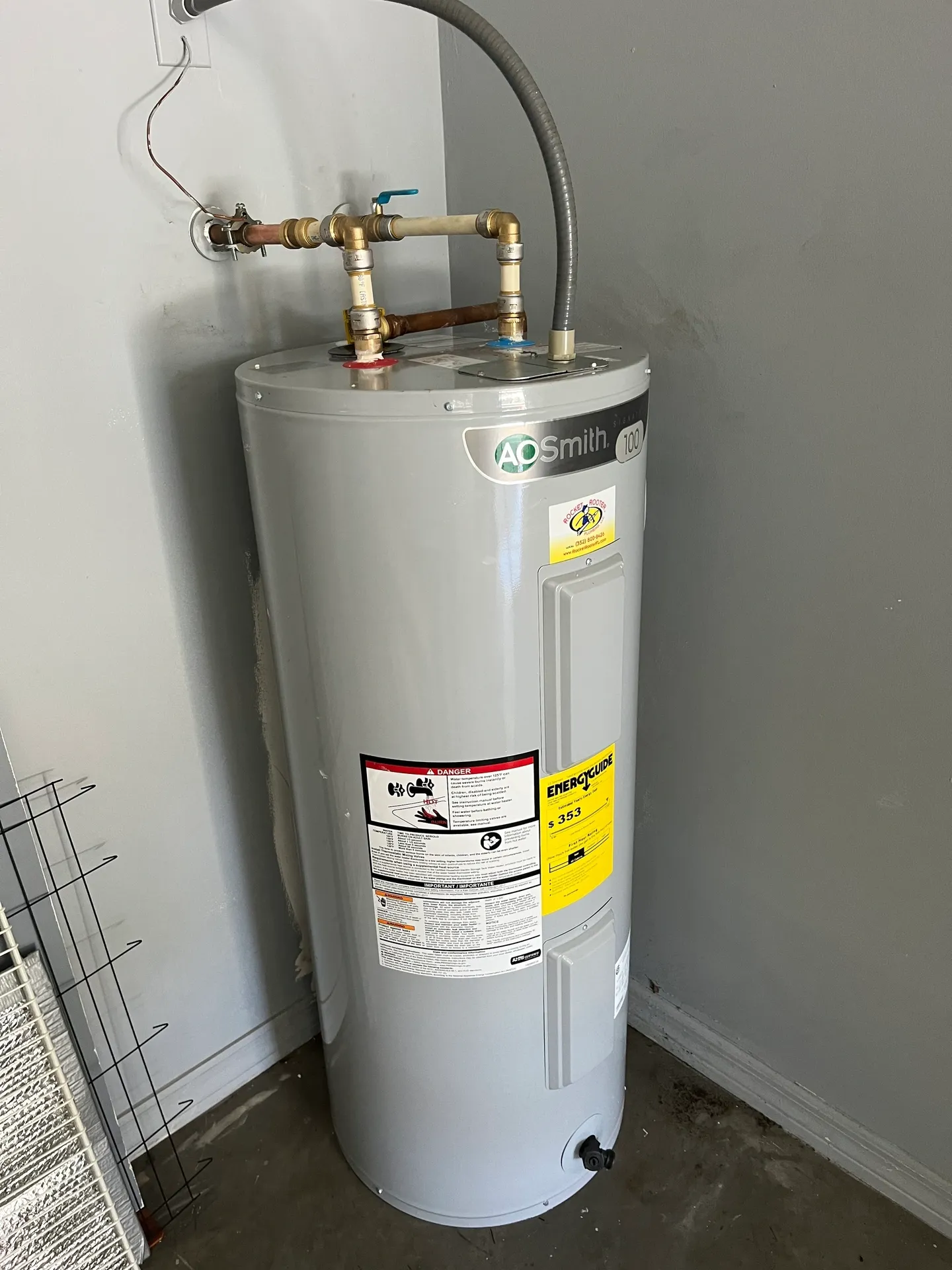 AO Smith tall water heater with piping